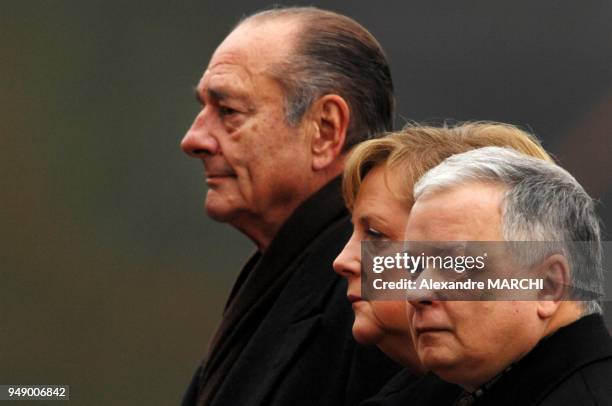 French President Jacques Chirac, German Chancellor Angela Merkel and Poland's President Lech Kaczynski.