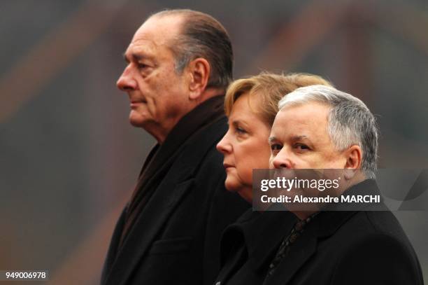 French President Jacques Chirac, German Chancellor Angela Merkel and Poland's President Lech Kaczynski.