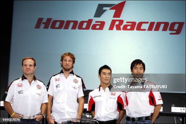 Honda Racing F1 team drivers Rubens Barrichello and Jenson Button pose with Super Aguri F1 team drivers Takuma Sato and Sakon Yamamoto during a press...