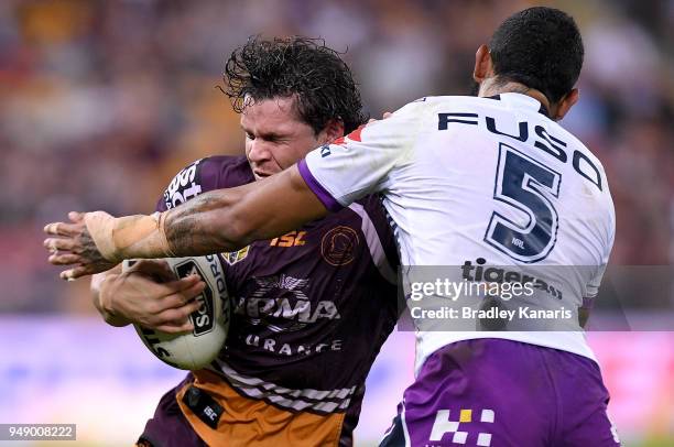 James Roberts of the Broncos takes on the defence during the round seven NRL match between the Brisbane Broncos and the Melbourne Storm at Suncorp...