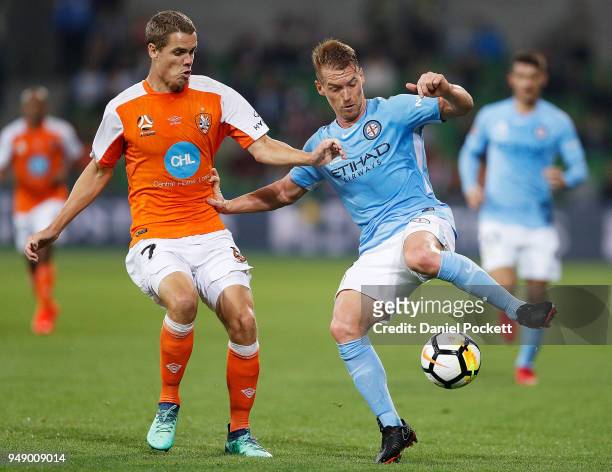 Oliver Bozanic of Melbourne City and Thomas Kristensen of Brisbane Roar contrst the ball during the A-League Elimination Final match between the...