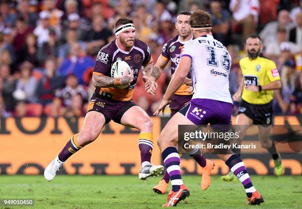 Josh McGuire of the Broncos takes on the defence during the round seven NRL match between the Brisbane Broncos and the Melbourne Storm at Suncorp...