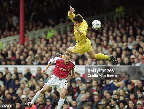 Harry Kewell of Leeds United rises above Lee Dixon of Arsenal during the FA Carling Premiership at Highbury in London. Arsenal won 2-1. \ Mandatory...