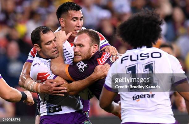Matthew Lodge of the Broncos takes on the defence during the round seven NRL match between the Brisbane Broncos and the Melbourne Storm at Suncorp...