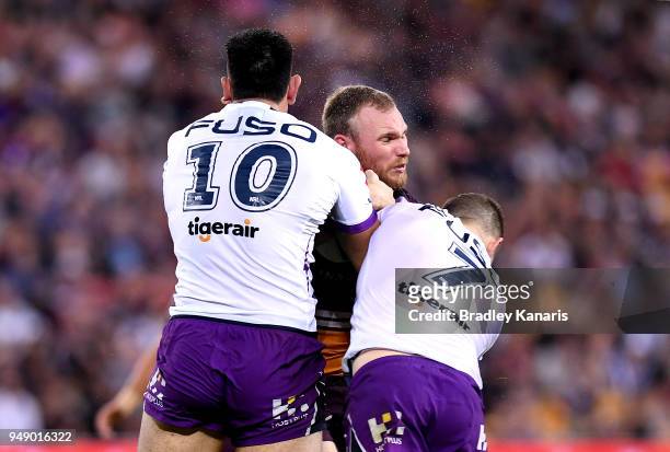Matthew Lodge of the Broncos takes on the defence during the round seven NRL match between the Brisbane Broncos and the Melbourne Storm at Suncorp...