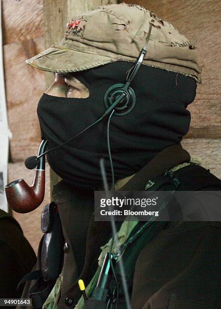 Subcomandante Marcos of the National Liberation Army smokes a pipe during a meeting with members of the Dolores Hidalgo commune in the State of...