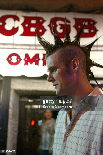 Brent Rogers, of Brooklyn, poses for a photograph outside of the famed music club CBGB, Saturday, August 20 in the Lower East Side of New York....