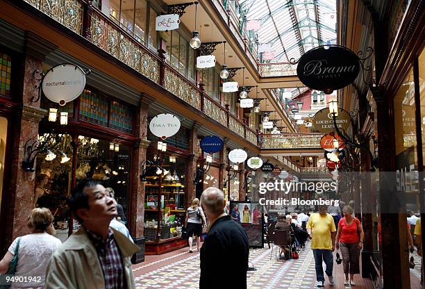 People walk through the Strand shopping arcade in Sydney, Australia, on Monday, Feb. 4, 2008. Australia's retail sales rose for a seventh month in...