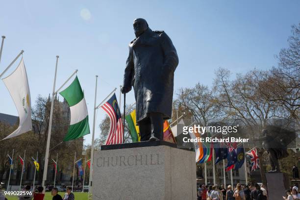 With the statue of former Prime Minister Sir Winston Churchill in the foreground, the flags of all Commonwealth Nations hang in Parliament Square on...