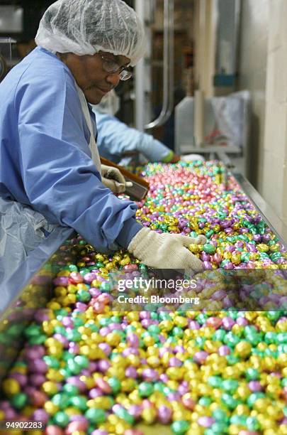 Chocolate eggs are inspected after being wrapped at the kosher certified Madelaine Chocolate Novelties, Inc. Factory in the Queens borough of New...