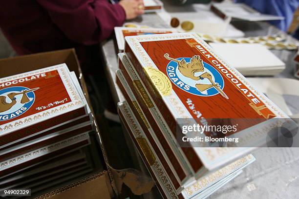 Chocolate cigar boxes sit after being packaged at the kosher certified Madelaine Chocolate Novelties, Inc. Factory in the Queens borough of New York,...