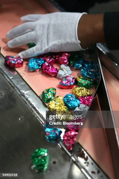 Chocolate bunnies are inspected after being wrapped at the kosher certified Madelaine Chocolate Novelties, Inc. Factory in the Queens borough of New...