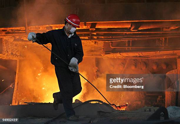 Worker at the Inner Mongolian Baotou Steel Union Co. Ltd. Handles molten steel, on Thursday, August 18 in Baotou, Inner Mongolia, China.