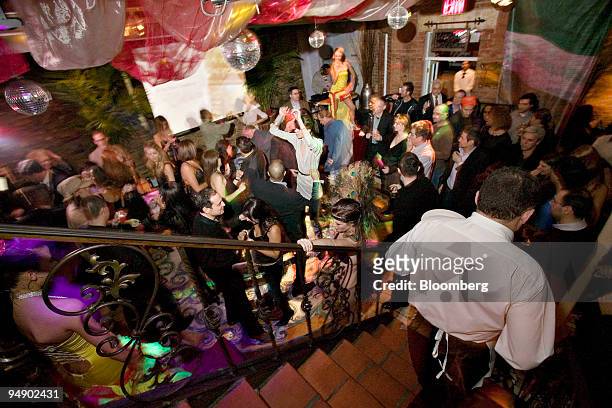 Attendees dance on the lower level of The Secret Garden of Dopo Teatro during a networking party hosted by Stefano Spadoni in New York, U.S., on...