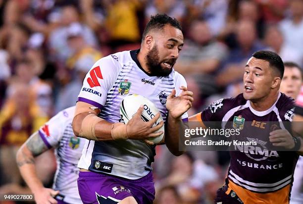Sam Kasiano of the Storm runs with the ball during the round seven NRL match between the Brisbane Broncos and the Melbourne Storm at Suncorp Stadium...