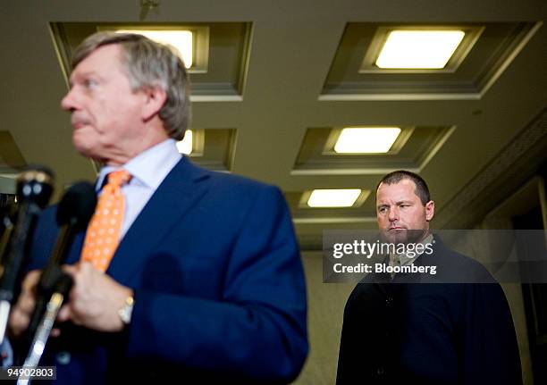 Roger Clemens, a former pitcher with Major League Baseball's New York Yankees, listens to his lawyer Rusty Hardin, left, speak, at a news conference...