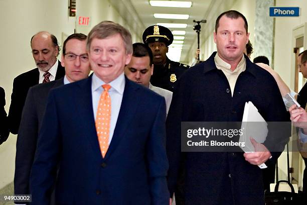 Roger Clemens, right, a former pitcher with Major League Baseball's New York Yankees, an his lawyer Rusty Hardin, foreground left, arrive for a...
