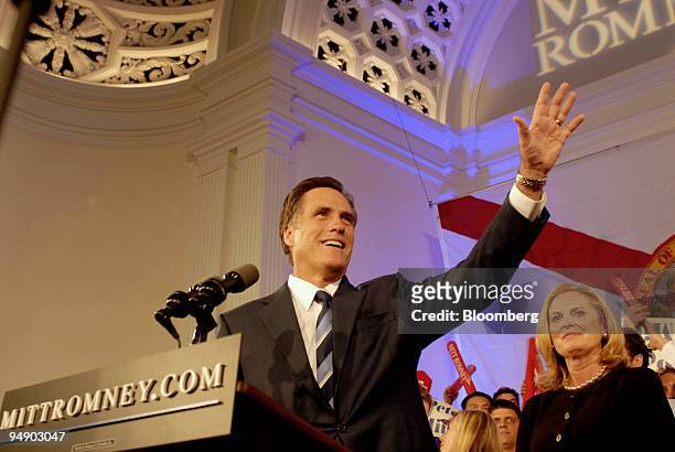 Mitt Romney, former governor of Massachusetts and 2008 Republican presidential candidate, speaks to supporters as his wife Ann Romney, right, looks...