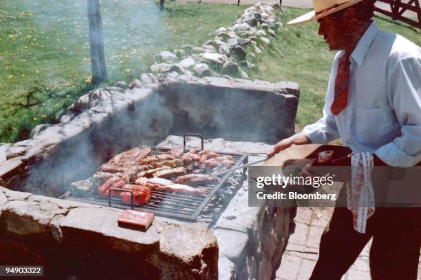 Meal is cooked on a wood-fired barbecue for lunch at the Los Chulengos ranch in Mendoza, Argentina, from Oct. 2007. If your idea of pastoral peace is...