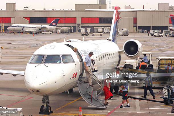 Delta Connection Atlantic Southeast Airlines jet sit parked on the tarmac at Hartsfield-Jackson Atlanta International Airport, following Delta's...
