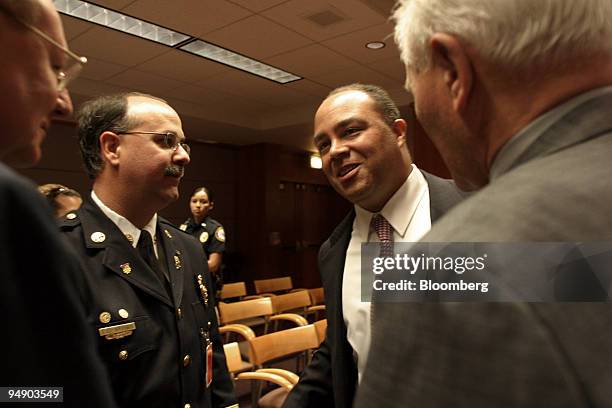 Michael Powell, Chairman of the Federal Communications Commission, center, talks with from, left to right, Harlin McEwen, chairman of the...