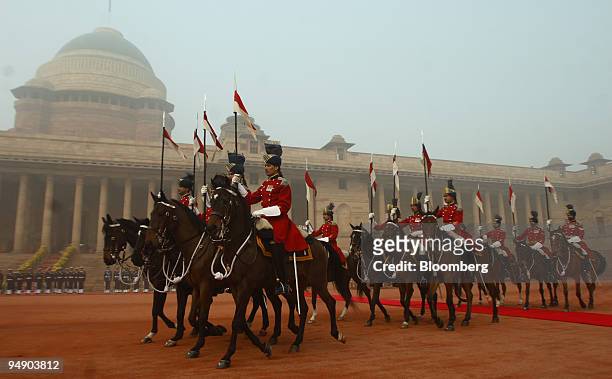Indian Presidential Guards arrive for a welcoming ceremony for Anders Fogh Rasmussen, prime minister of Denmark, at the Presidential Palace in New...