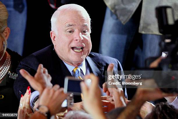 John McCain, U.S. Senator from Arizona and 2008 Republican presidential candidate, celebrates with supporters at a primary night rally in Miami,...