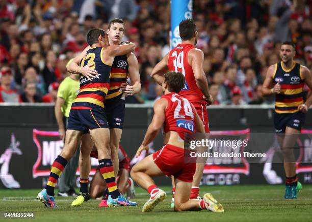 Taylor Walker of the Crows celebrates kicking a goal with team mates during the round five AFL match between the Sydney Swans and the Adelaide Crows...