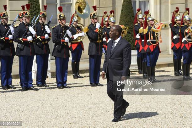 Ivory Coast President Alassane Dramane Ouattara arrives for for a meeting with French President Emmanuel Macron at Elysee Palace on April 20, 2018 in...