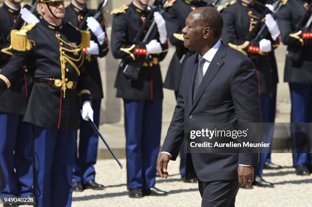 Ivory Coast President Alassane Dramane Ouattara arrives for for a meeting with French President Emmanuel Macron at Elysee Palace on April 20, 2018 in...