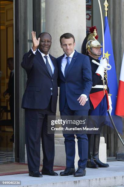 French President Emmanuel Macron welcomes Ivory Coast President Alassane Dramane Ouattara for a meeting at Elysee Palace on April 20, 2018 in Paris,...