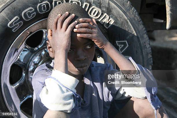 Child waits to be moved to a safe place by police in Naivasha, Kenya, on Tuesday, Jan. 29, 2008. Kenya's main opposition party appealed for calm...