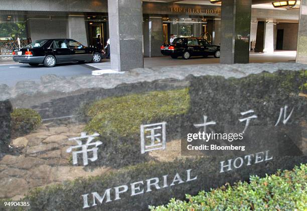 Cars pull up in front of the Imperial Hotel in Tokyo Wednesday, July 14, 2004. Colony Capital LLC, a Los Angeles-based real estate investor, said it...