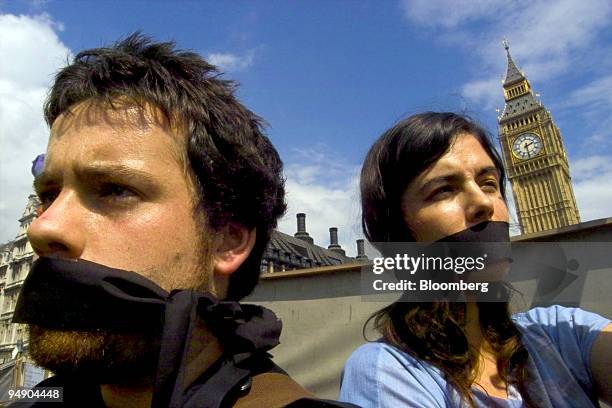 Demonstrators protest in front of the Houses of Parliament in central London, Monday, August 1, 2005. A new provision of the Serious and Organized...