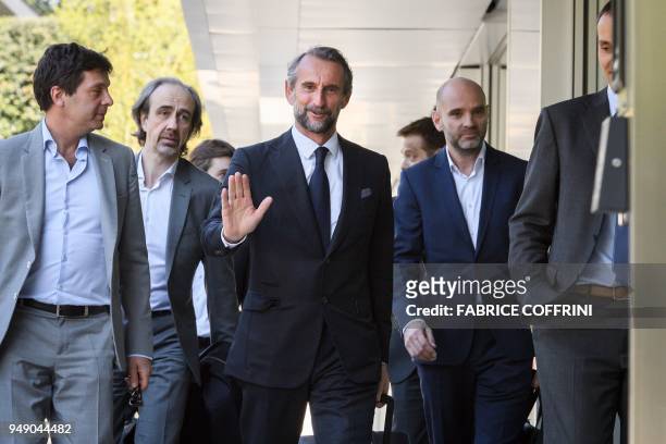 Paris Saint-Germain's assistant general manager Jean-Claude Blanc gestures next to deputy general director Philippe Boindrieux and secretary general...