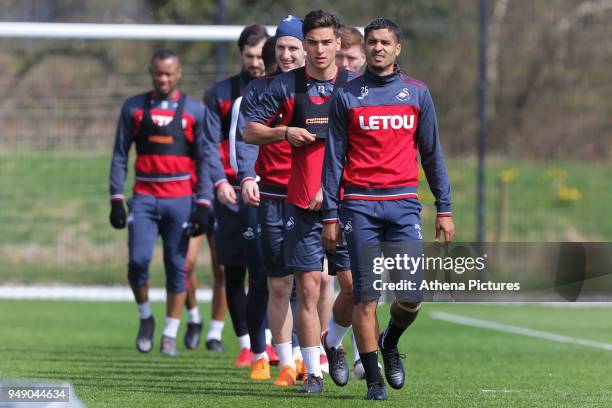 Kyle Naughton leads team mates to the pitch during the Swansea City Training at The Fairwood Training Ground on April 19, 2018 in Swansea, Wales.