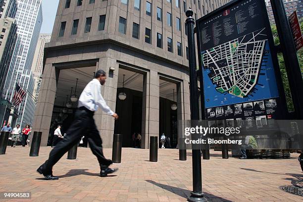 Man walks past an information map showing lower Manhattan in front of the Goldman Sachs building on Broad Street in the financial district of New...