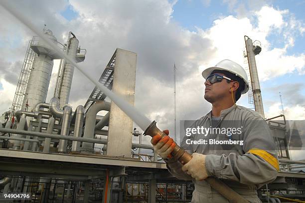 Chaco Co. Employee tests fire-fighting equipment at a gas plant in the tropical region of Chapare, Bolivia Friday, July 16, 2004. Bolivians voted on...