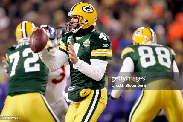 Brett Favre, quarterback for the Green Bay Packers, looks to pass during the NFC Championship game against the New York Giants in Green Bay,...