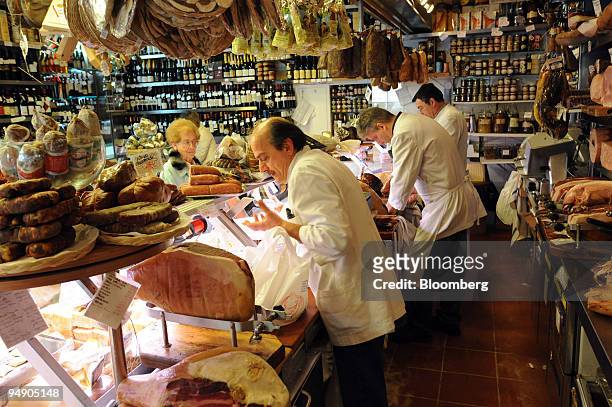 Customers are served at the Volpetti delicatessen in the Testaccio area of Rome, Italy, on Thursday, April 10, 2008. European retail sales dropped...