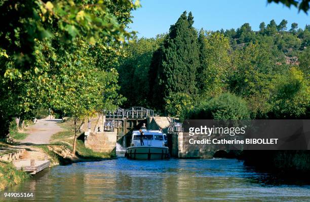 A lock gate near Argens, on one of the more picturesque parts of the Canal du Midi . Pays cathare: une écluse près d'Argens, sur l'une des parties...