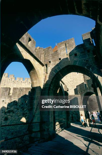 The fortified city of Carcassonne, the city can be entered through the Narbonnaise Gates . Pays cathare: la cité de Carcassonne, on entre dans la...
