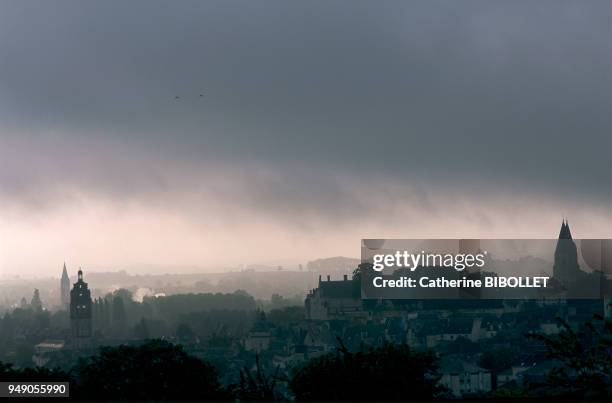 Panoramic view of Loches, Saint Antoine's Tower and the bell-towers of the Church of Saint Ours on a day of bad weather . Touraine: vue panoramique...