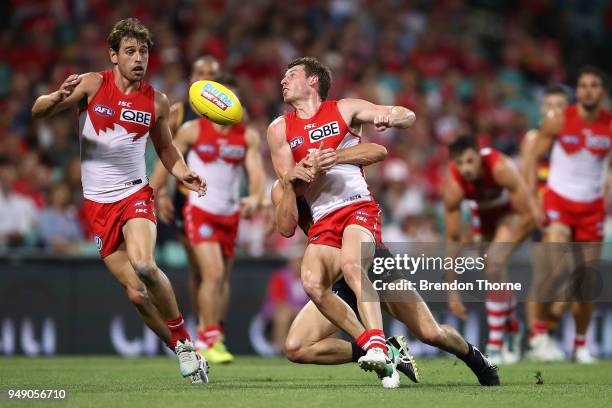 Harry Cunningham of the Swans handpasses during the round five AFL match between the Sydney Swans and the Adelaide Crows at Sydney Cricket Ground on...