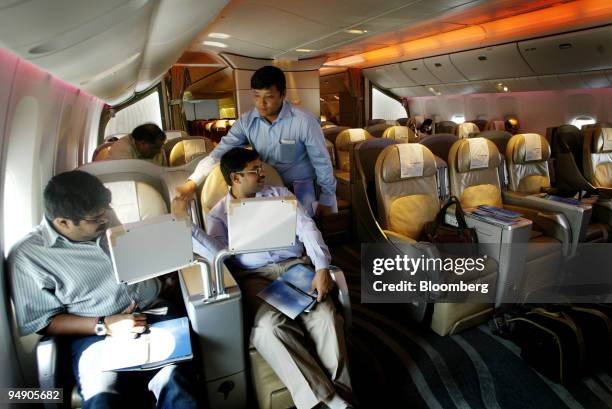 Journalists check various features of a Boeing 777-200LR Worldliner aircraft at Indira Gandhi International Airport in New Delhi, India, Thursday,...