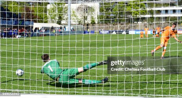 The Chelsea team celebrates winning with their goal keeper Jamie Cumming of Chelsea makes a save during the penalty shoot out at the Chelsea FC v FC...