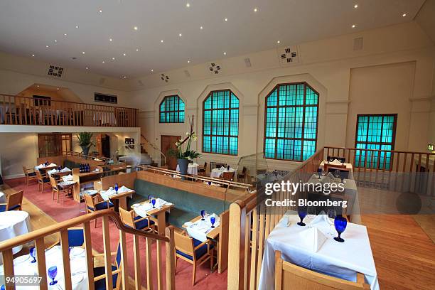Tables are set for service in the tea rooms at the Clarence Hotel in Dublin, Ireland, on Friday, Jan. 24, 2008. U2's Bono helped persuade George W....