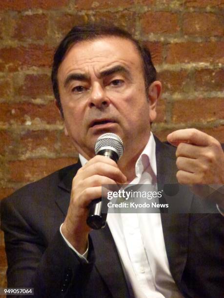 Carlos Ghosn, chairman and chief executive officer of the Renault-Nissan-Mitsubishi alliance, talks to media outlets in Hong Kong on April 20, 2018...