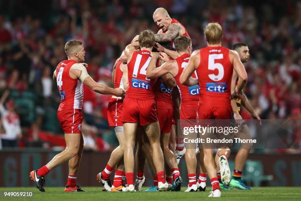 Gary Rohan of the Swans celebrates kicking a goal with team mates during the round five AFL match between the Sydney Swans and the Adelaide Crows at...