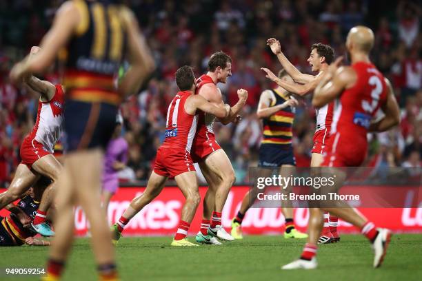 Harry Cunningham of the Swans celebrates kicking a goal with team mates during the round five AFL match between the Sydney Swans and the Adelaide...